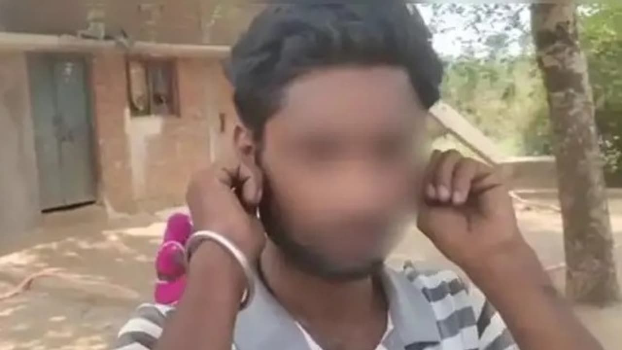 A young man doing sit ups while holding his ears in Satna