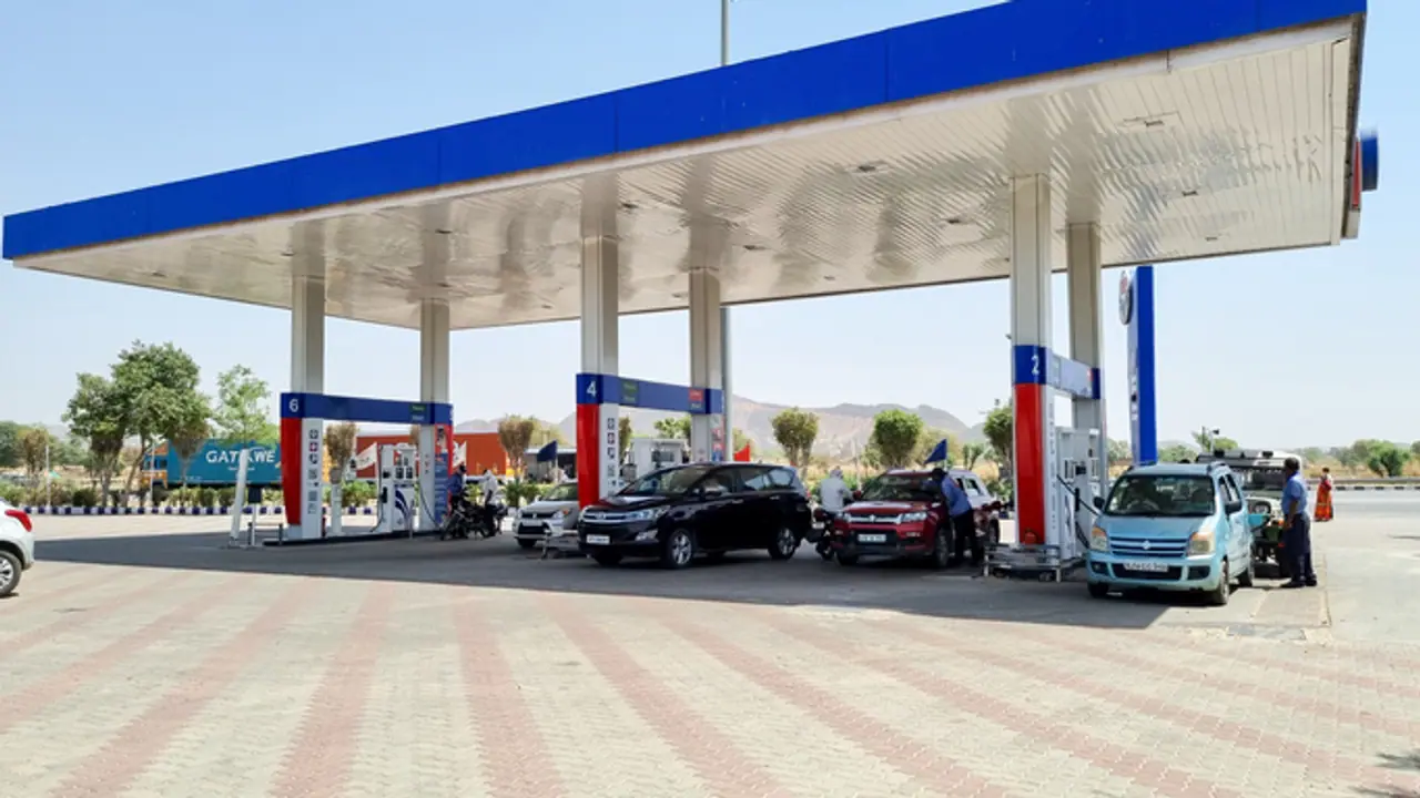 Delhi petrol pump with cars getting fuel