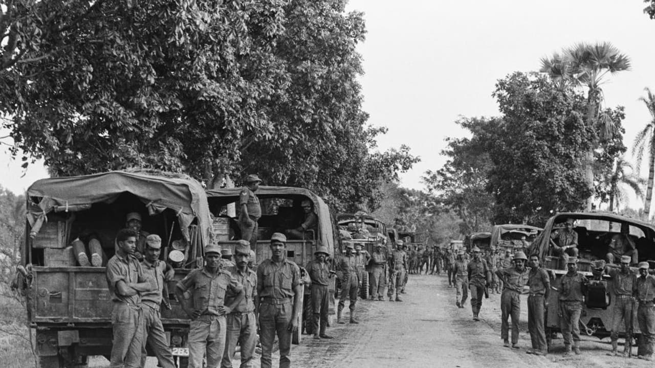 Pakistan army soldiers standing beside their military vehicles on a road during the East Pakistan Campaign of the Indo Pakistani War of 1971, December 22nd 1971. Pakistan army soldiers standing beside their military vehicles on a road during the East Pakistan Campaign of the Indo Pakistani War of 1971, December 22nd 1971.