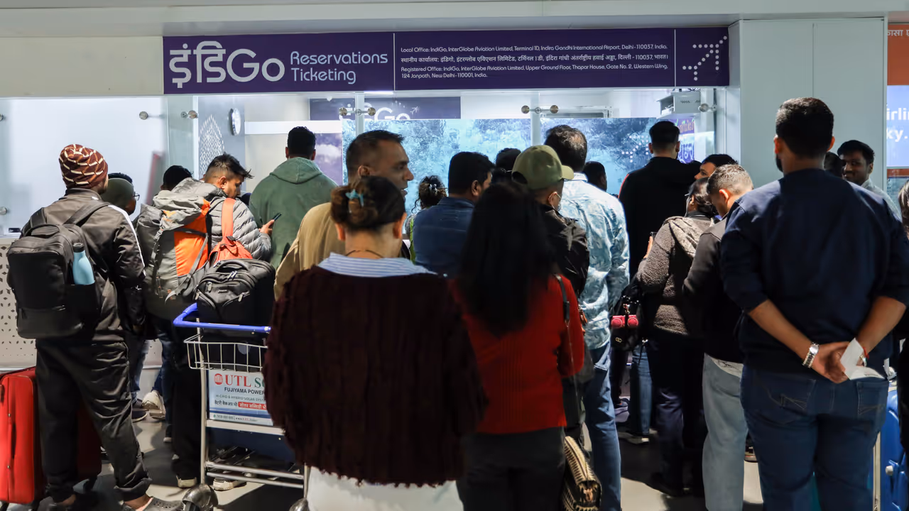 Passengers wait at the airport as IndiGo’s flight disruptions continue