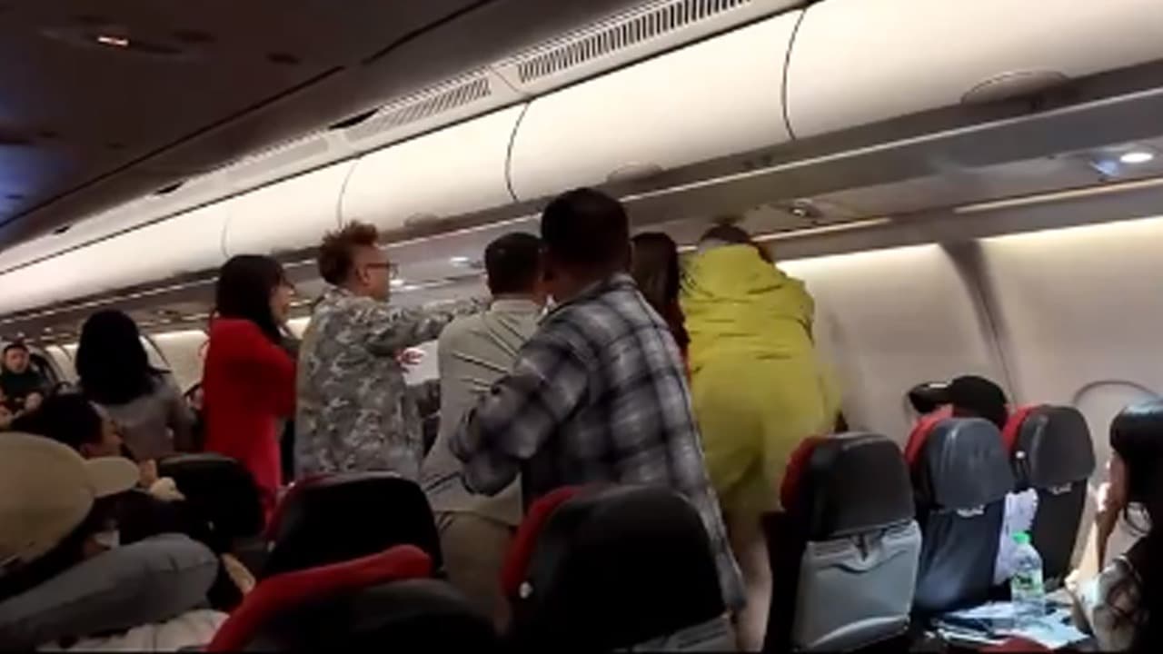 AirAsia flight turns into WWE ring AirAsia flight turns into WWE ring