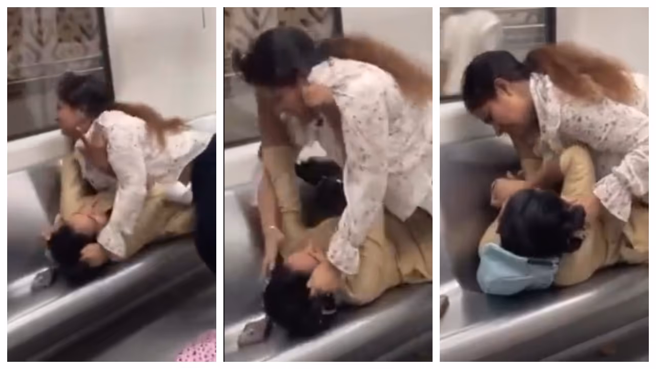 women fight over a seat in the Delhi Metro