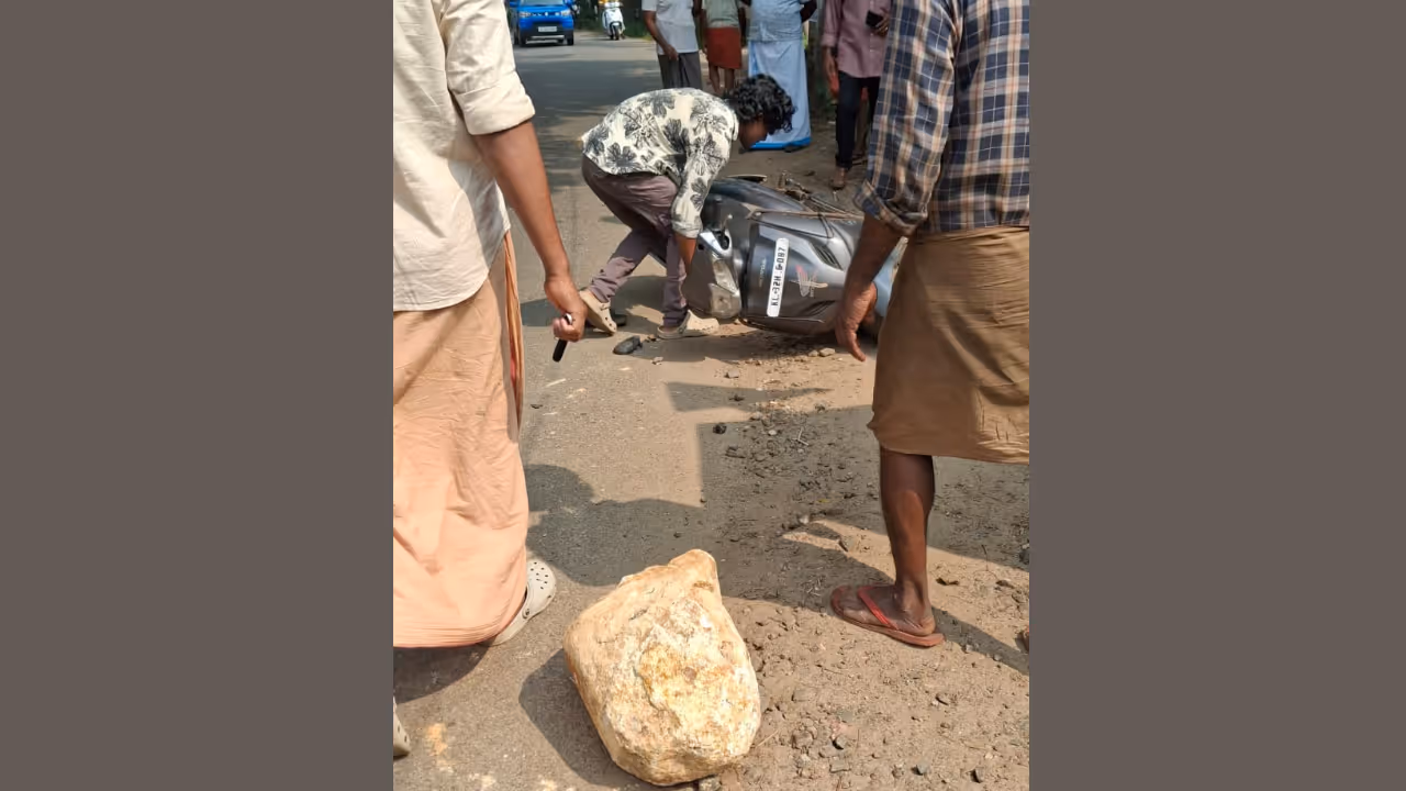 Biker Injured After Massive Rock Falls From Tipper Lorry In Alappuzha Biker Injured After Massive Rock Falls From Tipper Lorry In Alappuzha