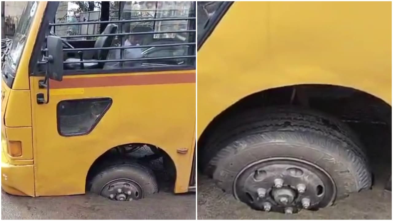 school bus front wheel fell in pothole