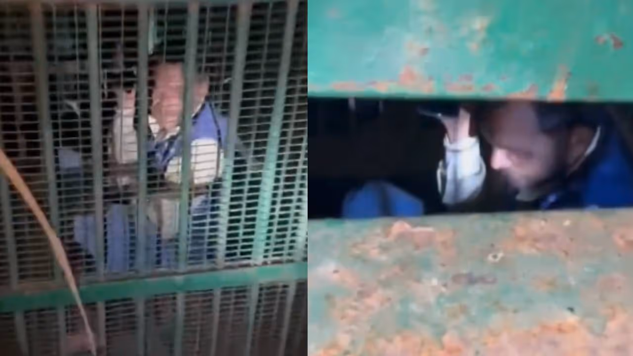 man trapped in metal cage intended to catch leopard