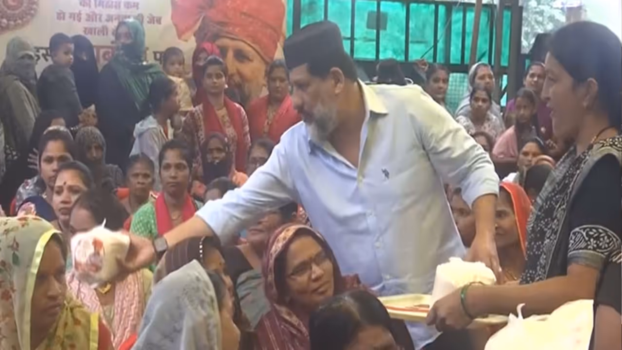 Congress MLA Arif Masood is distributing sugar packets to women at his residence (Photo/ANI) Congress MLA Arif Masood is distributing sugar packets to women at his residence (Photo/ANI)