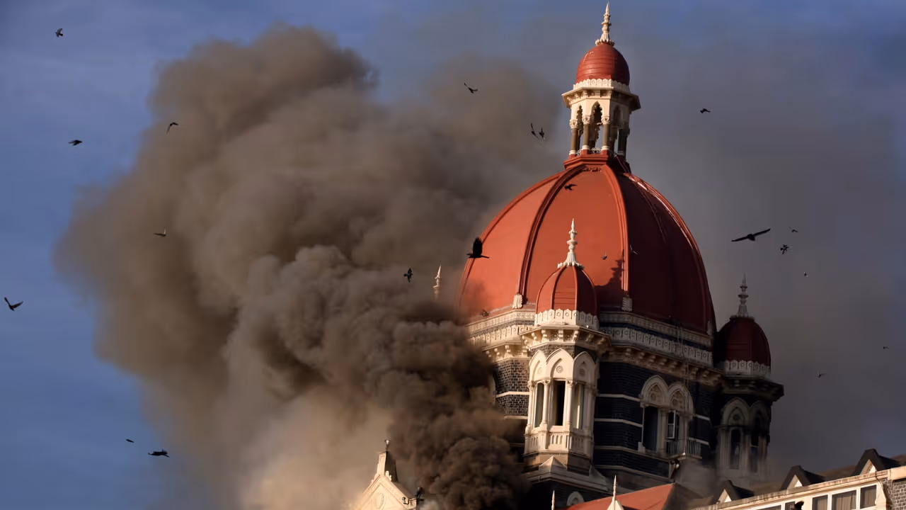 Smoke belching out from below the main Dom of Taj Hotel in Mumbai during 26/11 terror attacks Smoke belching out from below the main Dom of Taj Hotel in Mumbai during 26/11 terror attacks