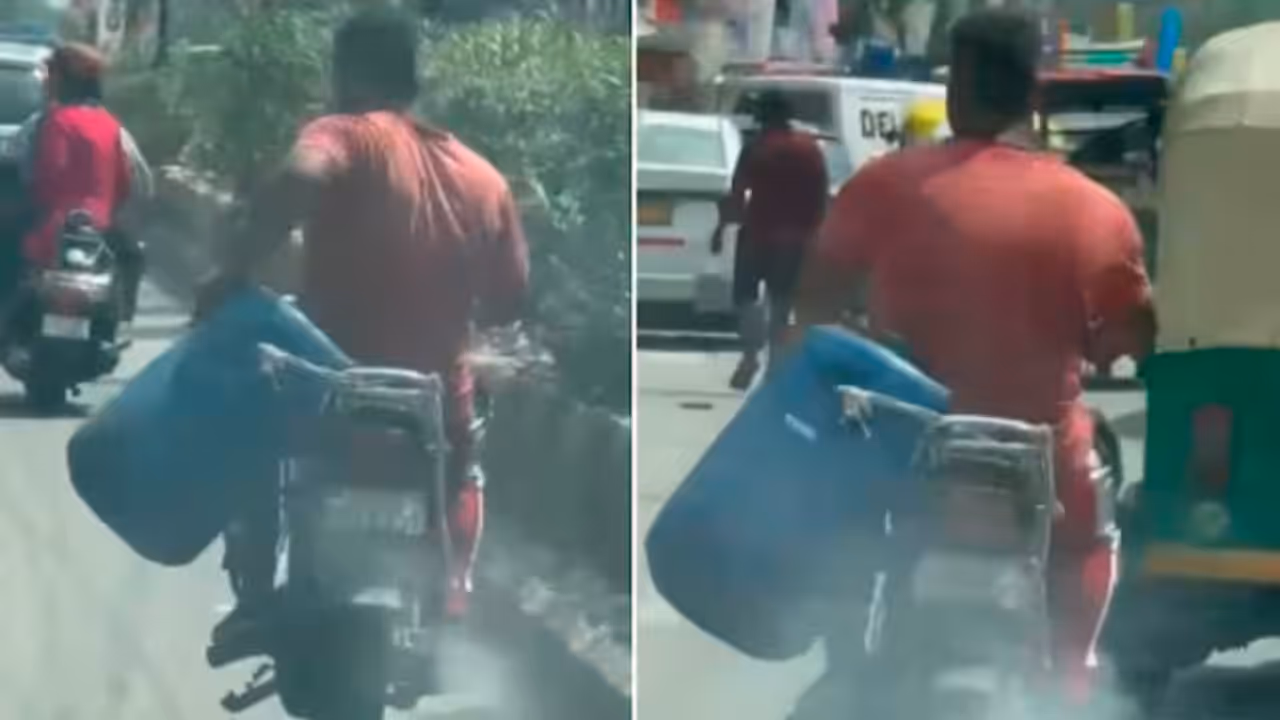 Caught on Camera: Delhi Man Spills Garbage on Road While Riding Bike, Viral Video Sparks Outrage | WATCH Caught on Camera: Delhi Man Spills Garbage on Road While Riding Bike, Viral Video Sparks Outrage | WATCH