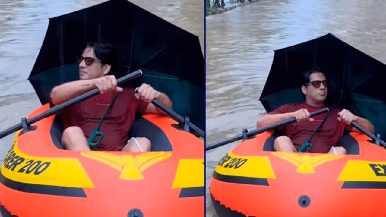 Actor travels by boat in Mumbai rain Actor travels by boat in Mumbai rain