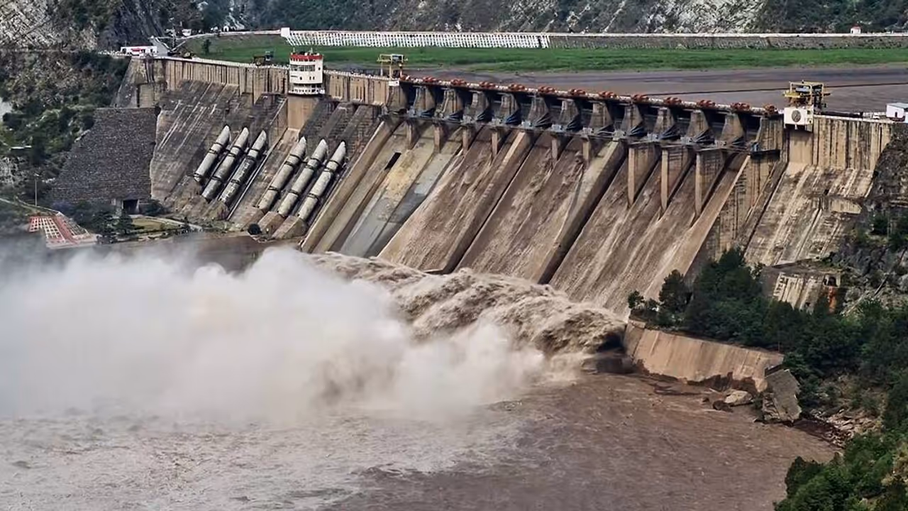 The gates of the Salal Dam open as the Chenab river swells up due to heavy rainfall