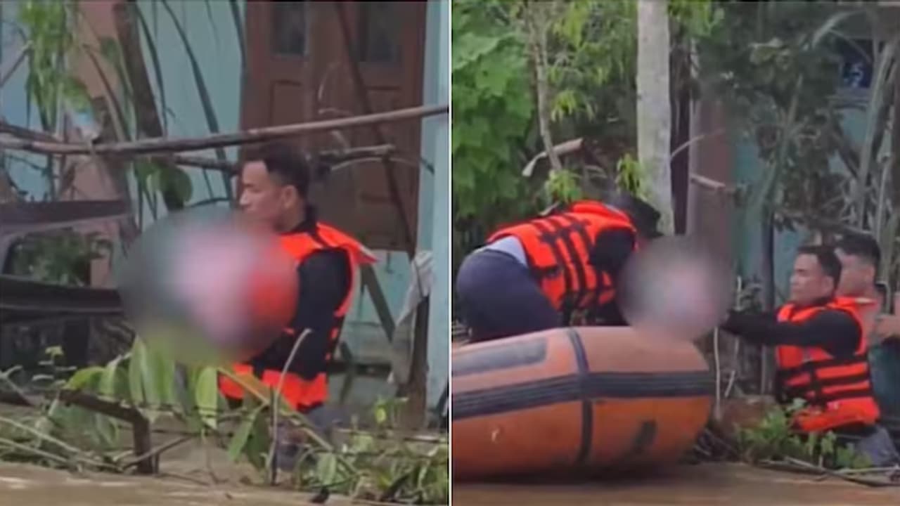 Sleeping Child Remains Undisturbed During Dramatic Assam Flood Rescue Sleeping Child Remains Undisturbed During Dramatic Assam Flood Rescue