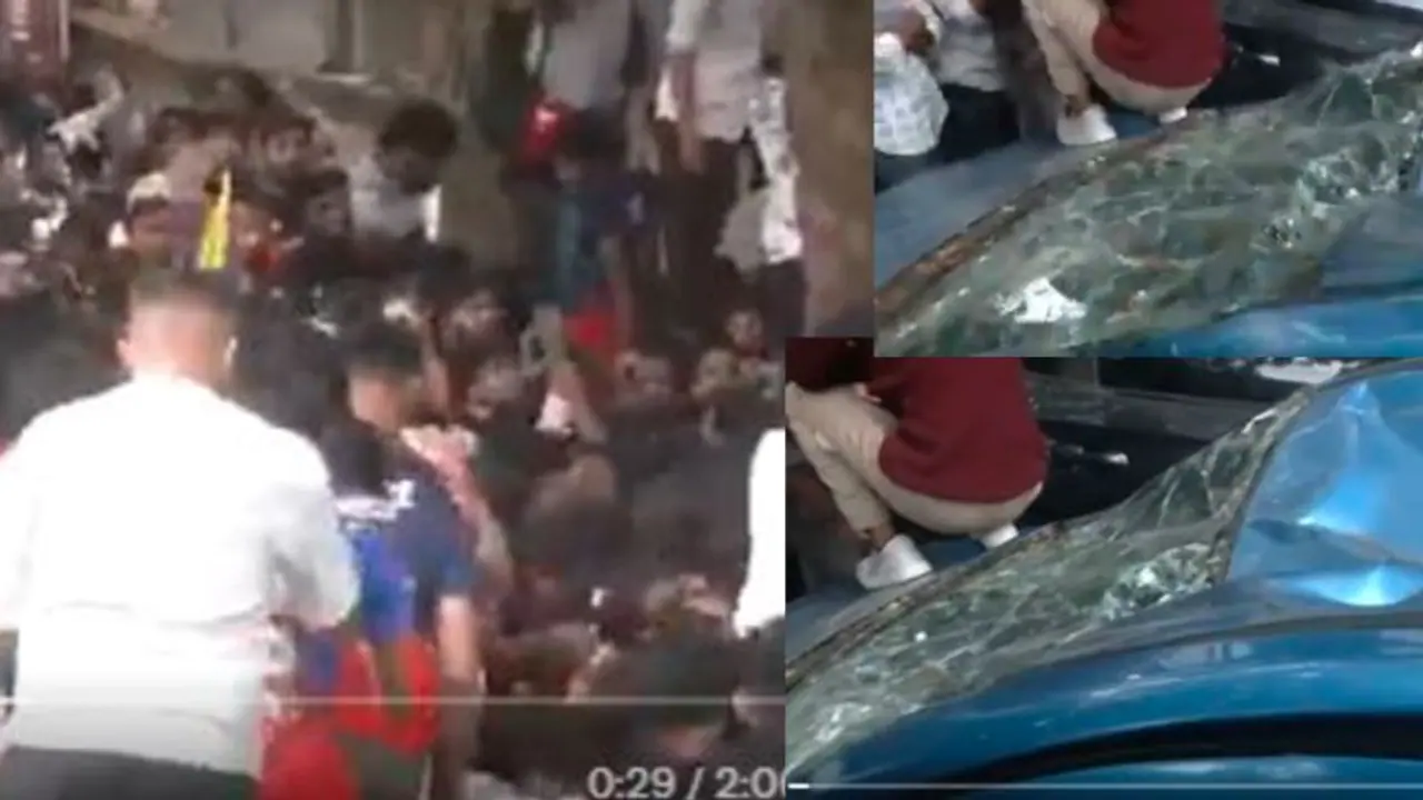  A car was damaged after fans climbed over it outside