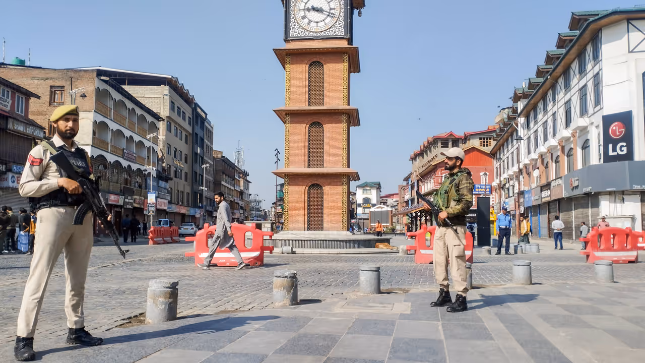 J&K police personnel stand guard at Lal Chowk 