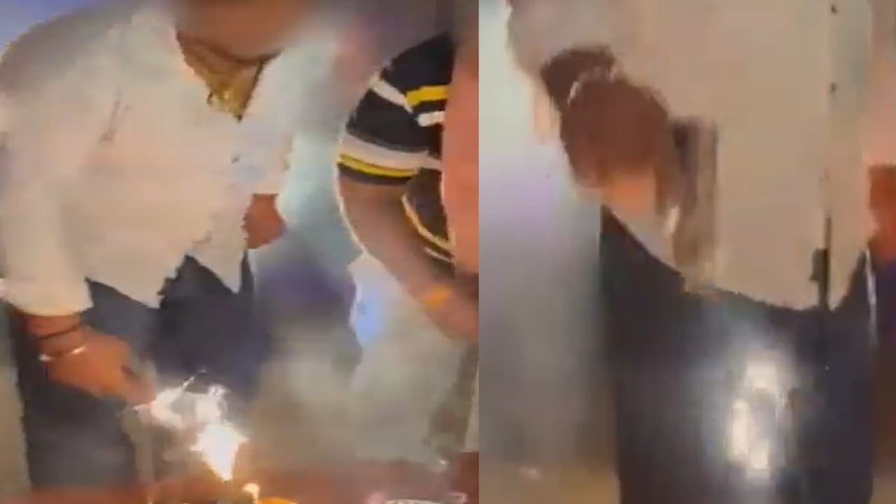 delhi man cutting birthday cake with gun delhi man cutting birthday cake with gun