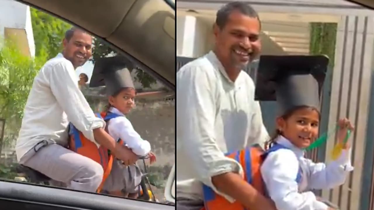 Viral Video: Little Girl Shows Off Her Medal on Cycle Ride With Dad—Internet Smiles (WATCH)