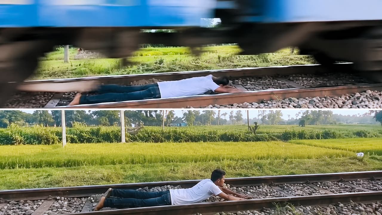 Man Does Dangerous Stunt By Lying On Railway Track While Train Passes ...