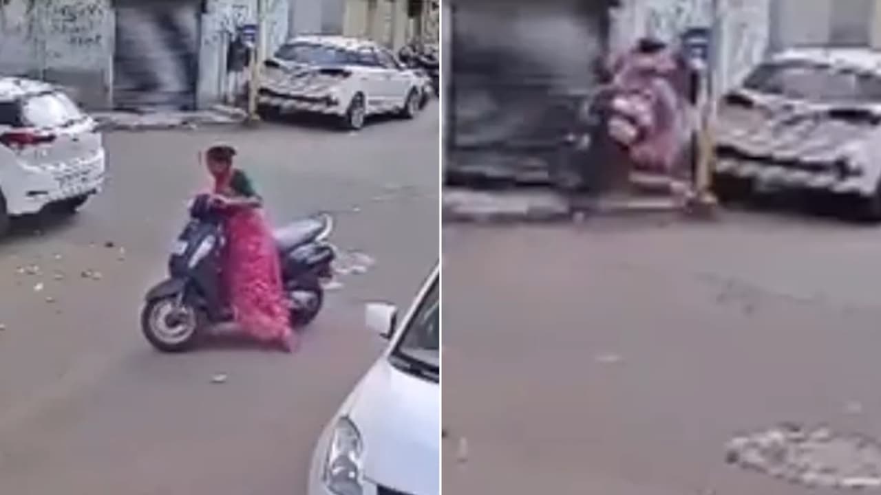 Watch: Woman Loses Control of Activa, Crashes Straight Into Shop Shutter in Rajkot; CCTV Video Goes Viral