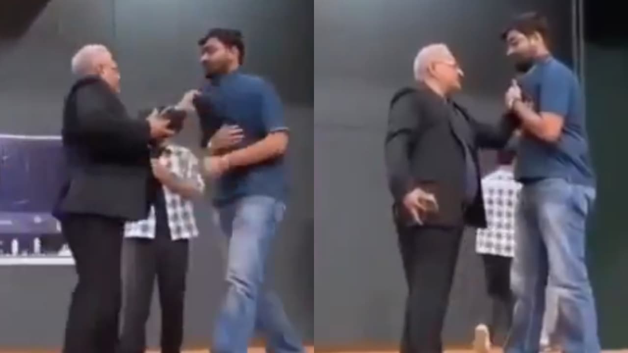 During comedian Rajat Sood’s show at Nirma University, a student heckled a professor with a viral movie quote. The professor called him on stage and grabbed his collar. The incident was caught on camera, sparking debate on social media.