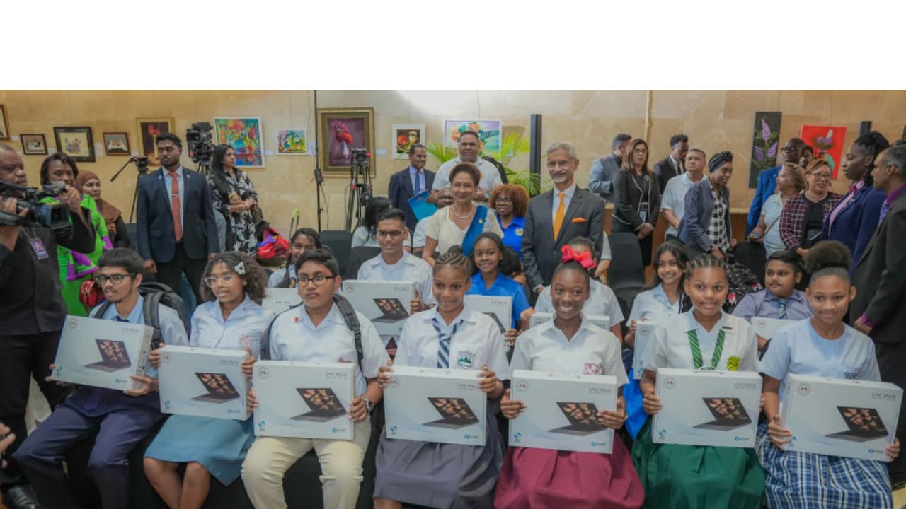 Jaishankar, T&T PM gift laptops; seal bilateral cooperation deals