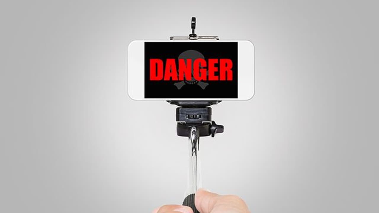 Mumbai boy on moving train steals phone to make viral video Mumbai boy on moving train steals phone to make viral video