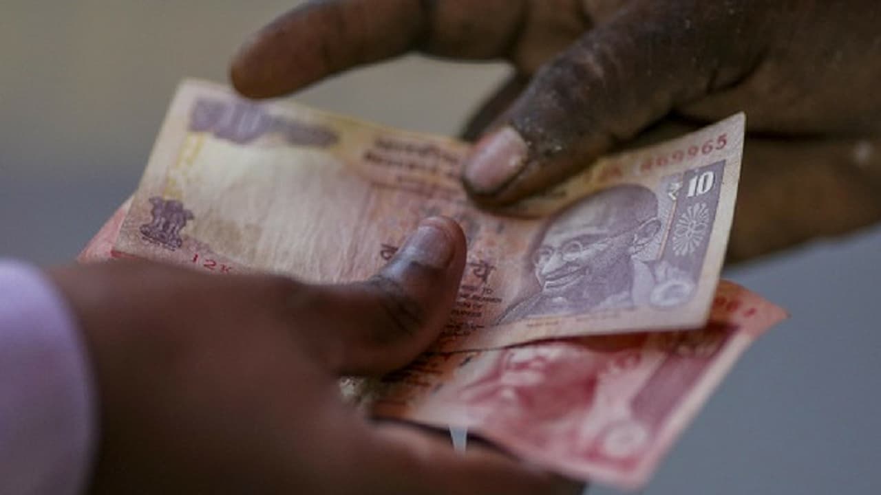 Indian rupee hits record low against dollar, breaches the 70 mark