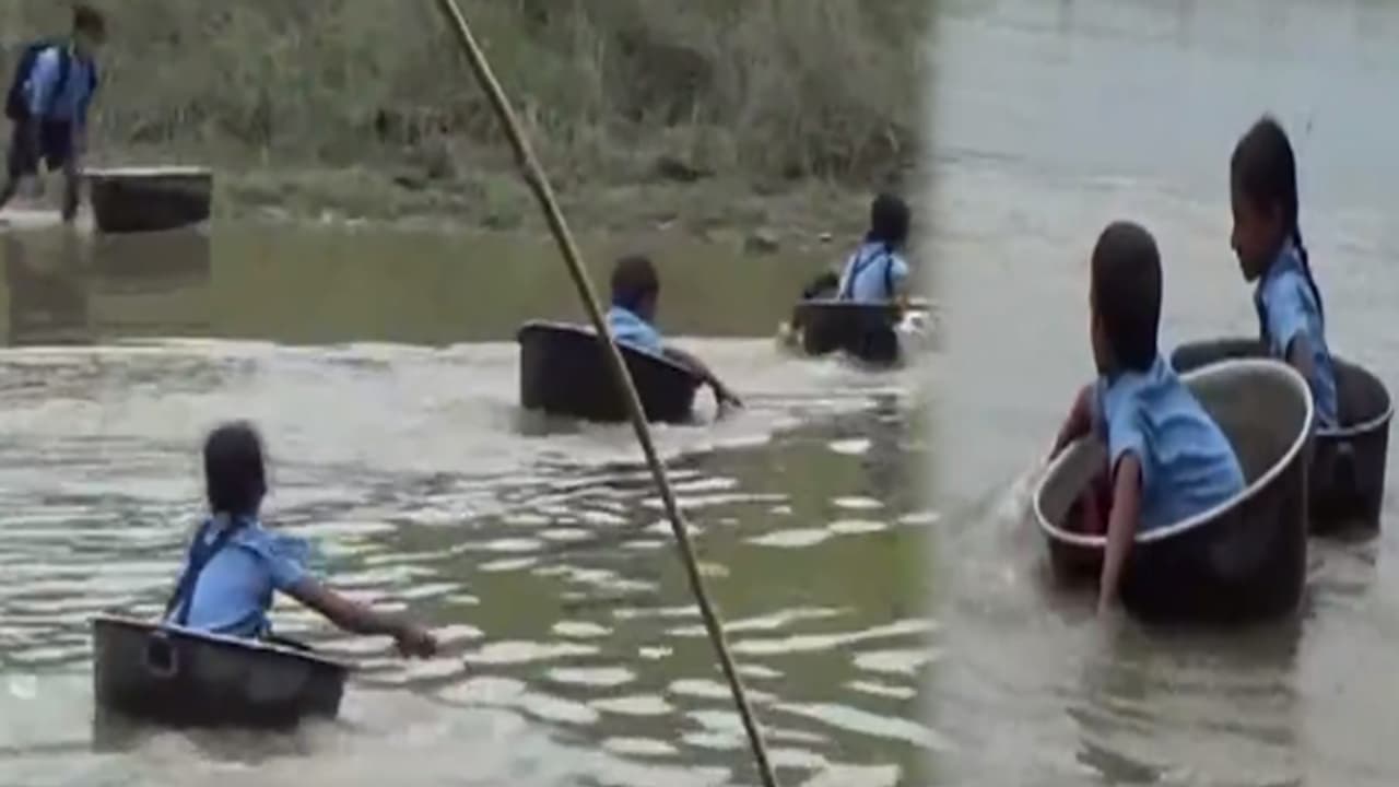 ജീവന് പണയം വച്ച് അലുമിനിയം പാത്രത്തില് പുഴ കടക്കുന്ന വിദ്യാര്ത്ഥികള് ജീവന് പണയം വച്ച് അലുമിനിയം പാത്രത്തില് പുഴ കടക്കുന്ന വിദ്യാര്ത്ഥികള്