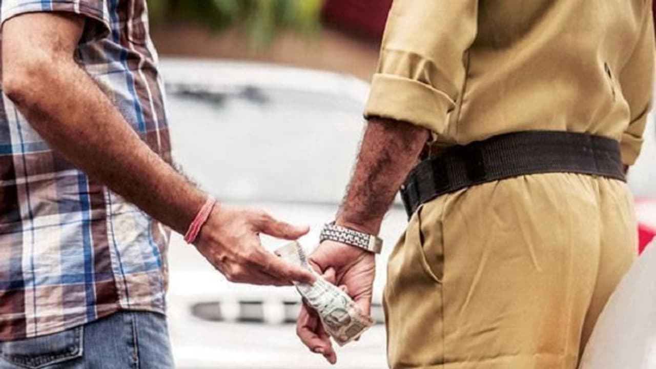 Policeman caught taking bribe from missing girl's brother Policeman caught taking bribe from missing girl's brother