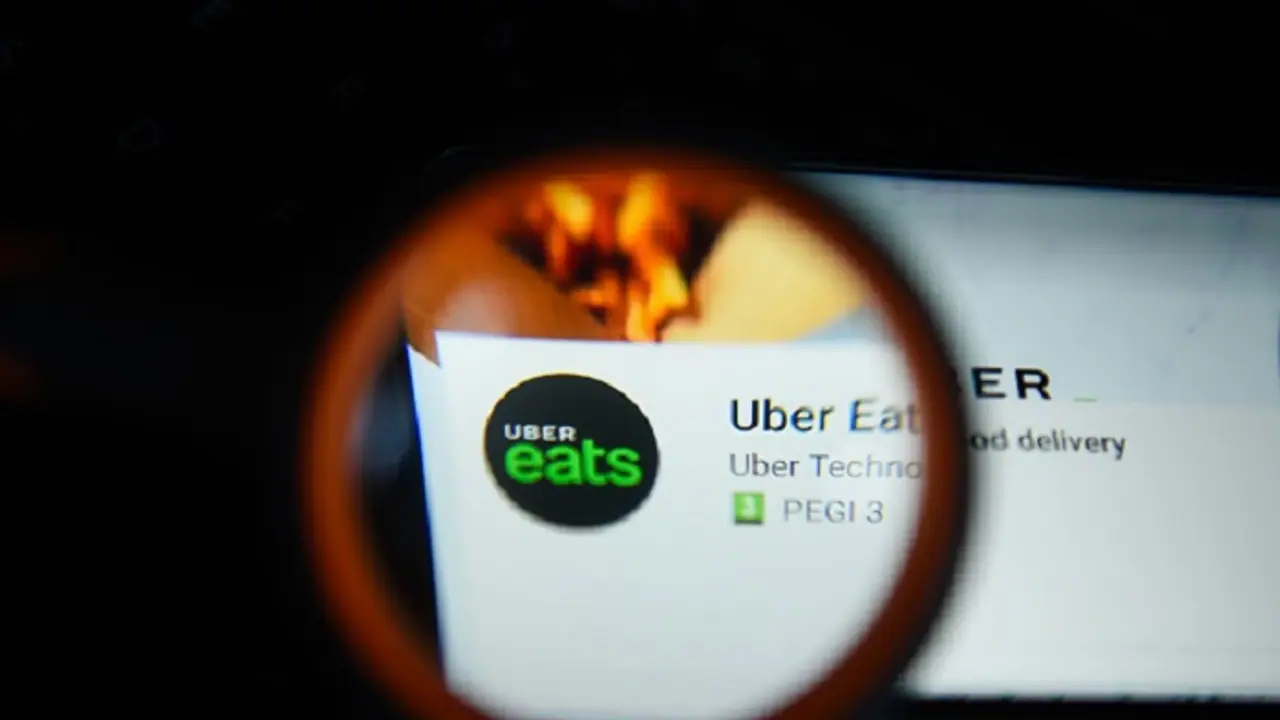 Customer orders from Uber Eats, deliveryman takes a stealthy bite Customer orders from Uber Eats, deliveryman takes a stealthy bite