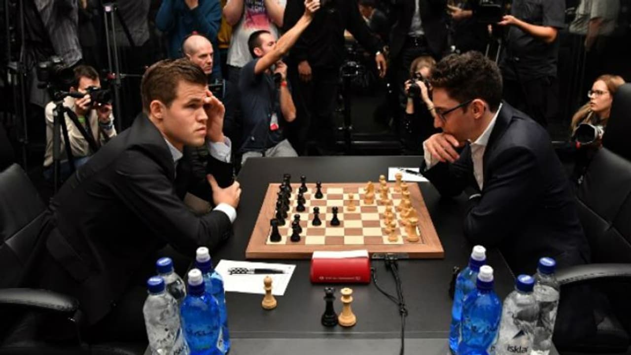 സമനില തെറ്റാതെ കാൾസണ് കരുവാന ലോക ചെസ് ചാമ്പ്യൻഷിപ്പ് പോരാട്ടം സമനില തെറ്റാതെ കാൾസണ് കരുവാന ലോക ചെസ് ചാമ്പ്യൻഷിപ്പ് പോരാട്ടം