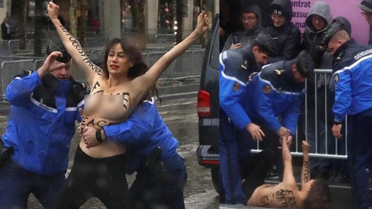 'വ്യാജ സമാധാനസ്ഥാപകന്'; പാരീസിലെത്തിയ ട്രംപിന് നേരെ മാറിടം കാട്ടി യുവതിയുടെ പ്രതിഷേധം 'വ്യാജ സമാധാനസ്ഥാപകന്'; പാരീസിലെത്തിയ ട്രംപിന് നേരെ മാറിടം കാട്ടി യുവതിയുടെ പ്രതിഷേധം