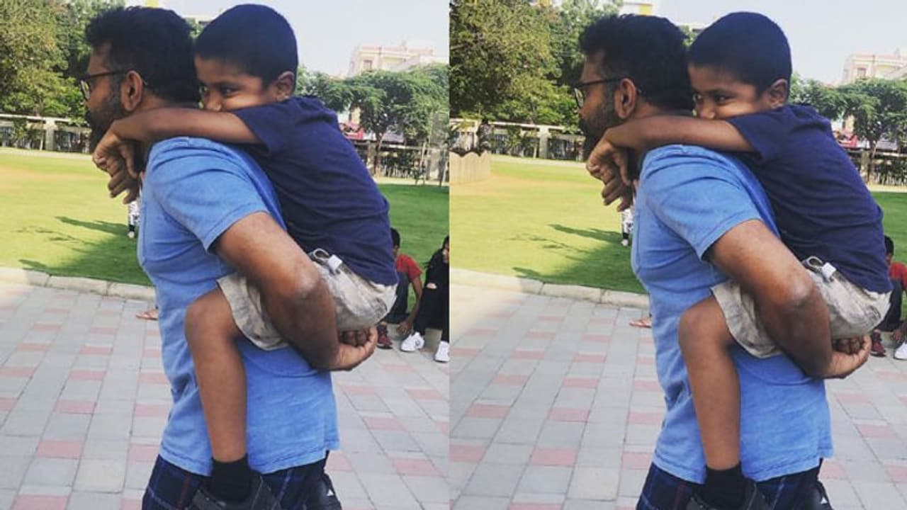 కొడుకుని ఉప్పు బస్తాలా మోస్తూ సుకుమార్ (పర్శనల్ ఫొటో)