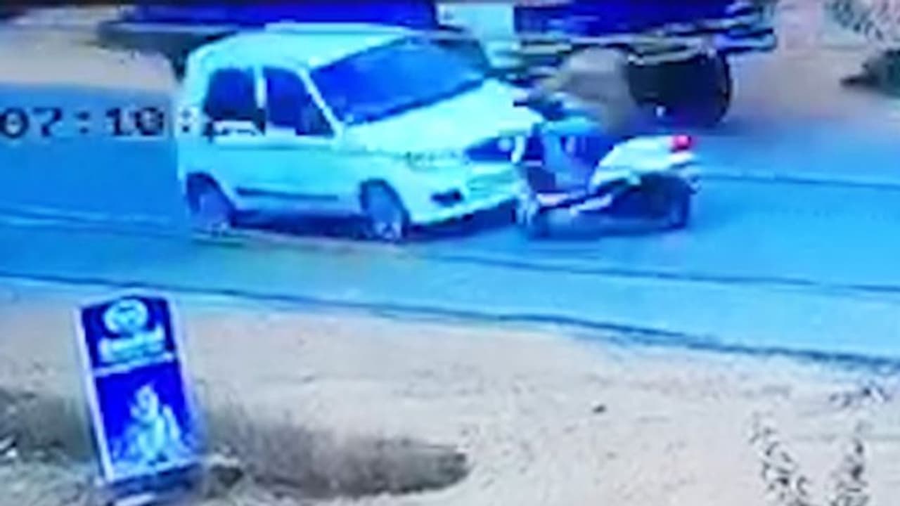 Karnataka man has miraculous escape after his bike hits car, truck Karnataka man has miraculous escape after his bike hits car, truck