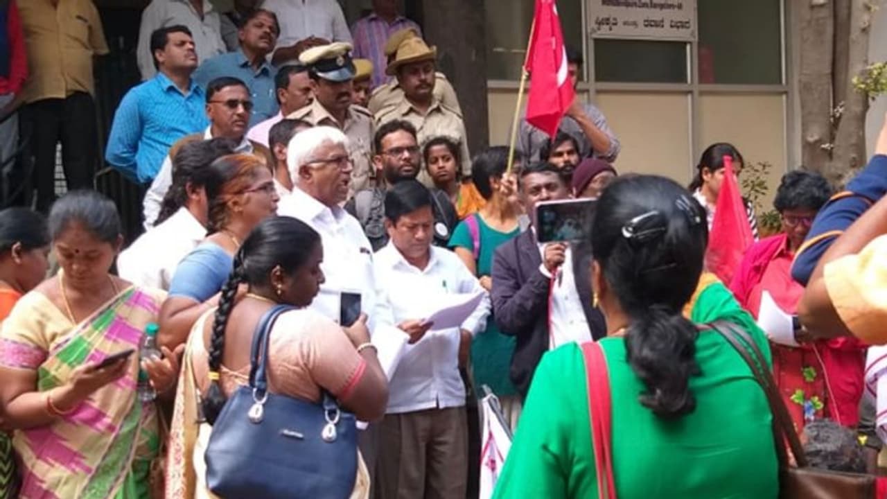Migrant workers lay siege BBMP office over power cuts Migrant workers lay siege BBMP office over power cuts