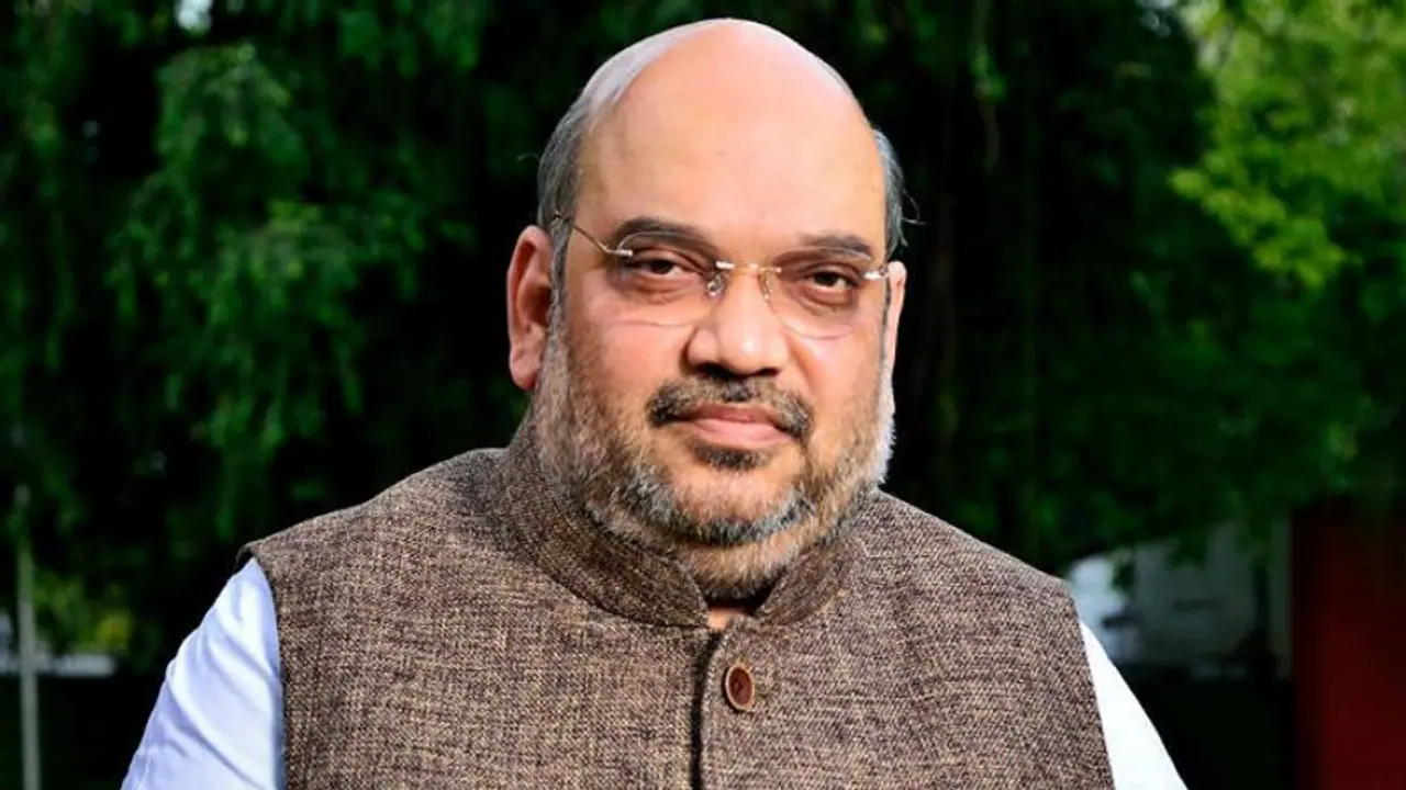 Shah: Modi working continuously for 20 years; Rahul holidays every 2 months