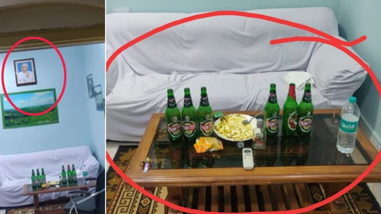 दीवार पर टंगी थी गांधीजी की तस्वीर, टेबल पर सजा था 'मयखाना', सामने आया VIP रूम का सच दीवार पर टंगी थी गांधीजी की तस्वीर, टेबल पर सजा था 'मयखाना', सामने आया VIP रूम का सच
