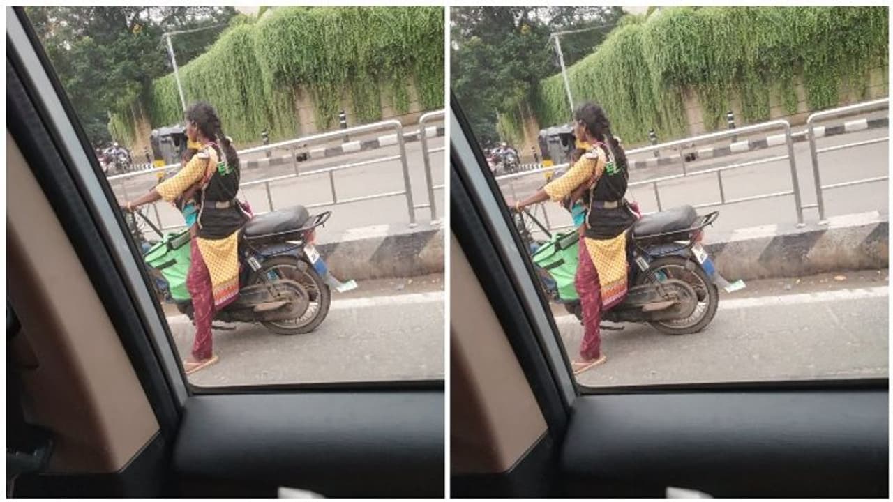 மார்போடு கட்டி அணைத்த பிஞ்சுக்குழந்தை...! வெயில்.. மழை.. சிக்னல்..! இரு சக்கர வாகனத்தில் வீடு வீடாய் சென்று டெலிவரி செய்யும் தாய்...! மார்போடு கட்டி அணைத்த பிஞ்சுக்குழந்தை...! வெயில்.. மழை.. சிக்னல்..! இரு சக்கர வாகனத்தில் வீடு வீடாய் சென்று டெலிவரி செய்யும் தாய்...!