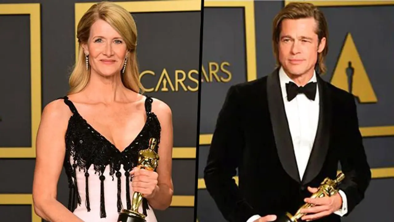 Brad Pitt and Laura Dern accept the Oscar for best supporting actor and actress