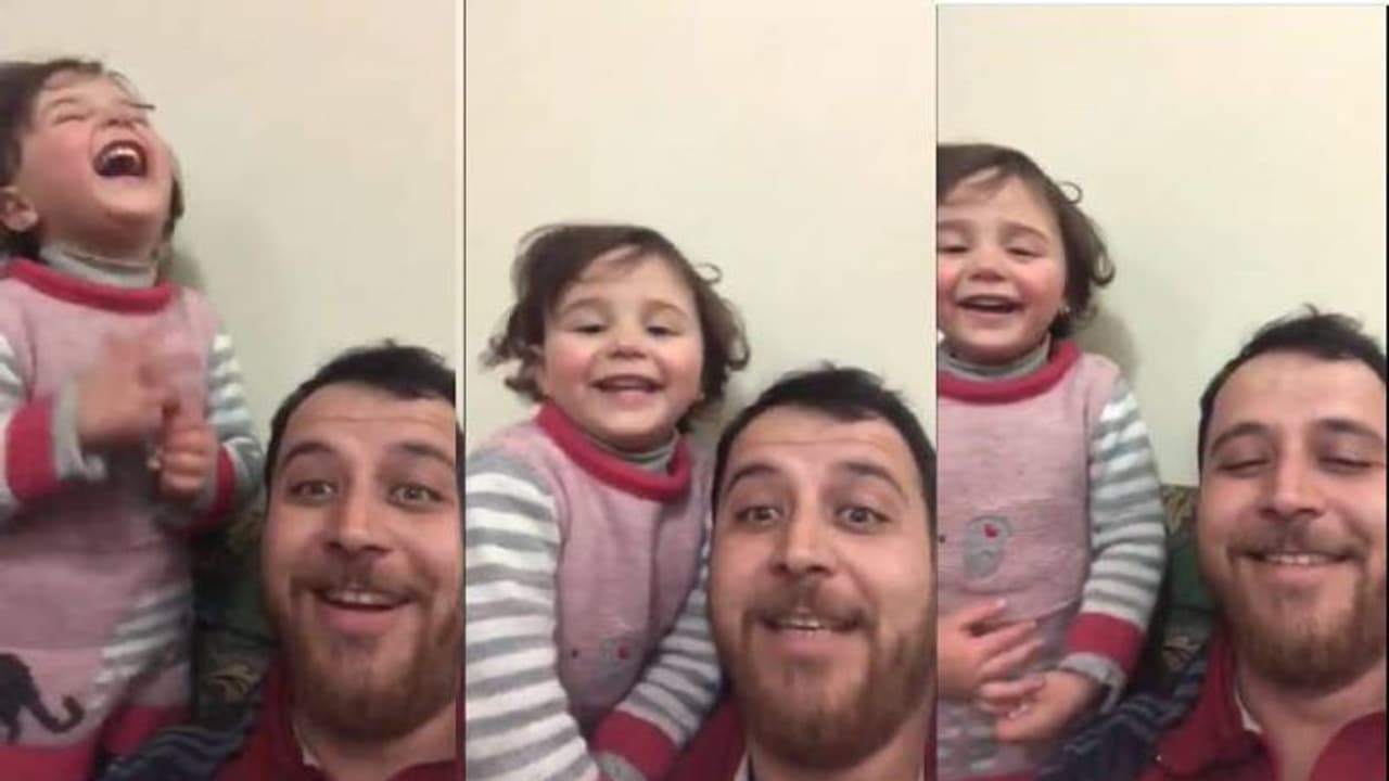 പുറത്ത് ബോംബേറ്; ശബ്‍ദം കേട്ട് മകൾ പേടിക്കാതിരിക്കാൻ പൊട്ടിച്ചിരിപ്പിച്ച് അച്ഛൻ വൈറൽ വീഡിയോ