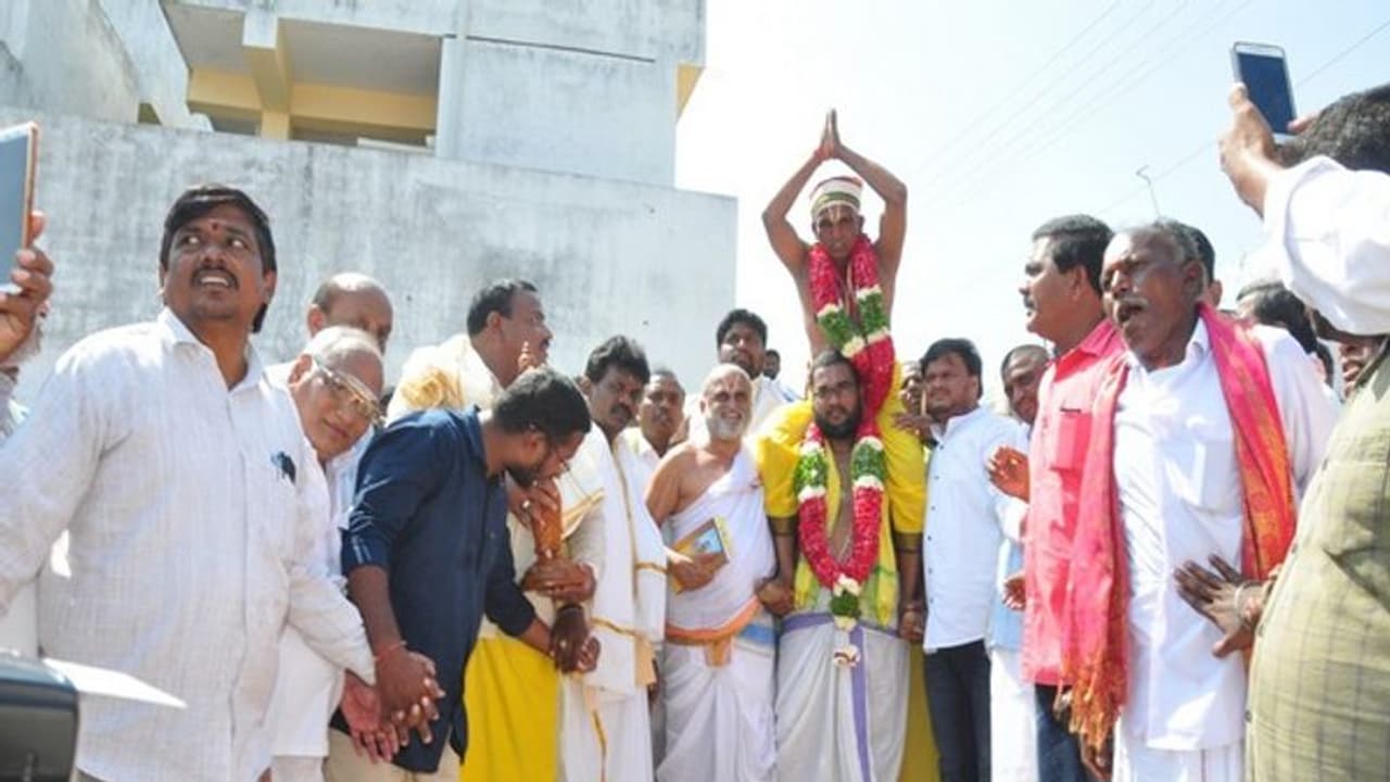 Temple priest carries Dalit devotee on shoulder during 'Munivahana Utsavam'