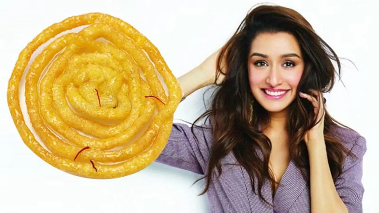 Shraddha Kapoor can’t hide her glee as Tiger Shroff gifts giant jalebi on her birthday Shraddha Kapoor can’t hide her glee as Tiger Shroff gifts giant jalebi on her birthday
