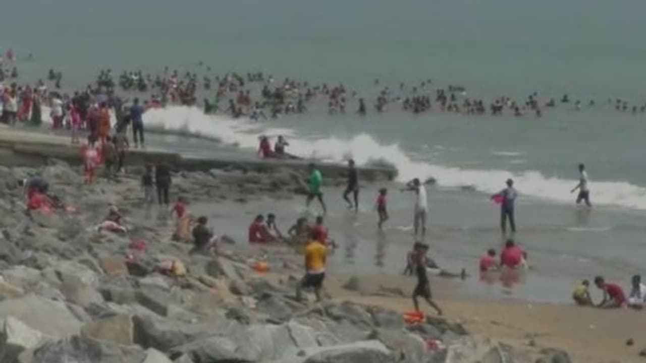 Tourist enjoys bathing in sea at Digha