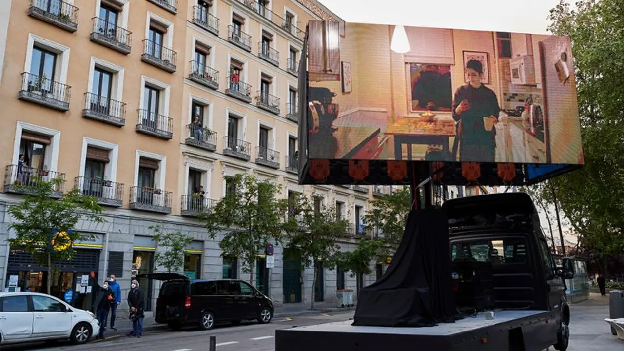 Residents entertain themselves with 'balcony cinema' amid lockdown in Madrid Residents entertain themselves with 'balcony cinema' amid lockdown in Madrid