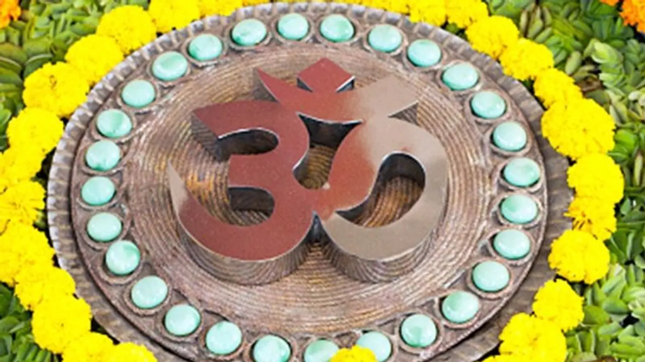 Om   Realization of the supreme cosmic principle of Brahman in Hinduism