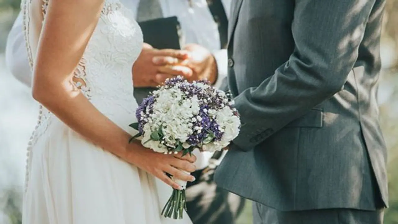 Awkward! Groom grabs bride's buttocks while preacher prays at wedding; video goes viral