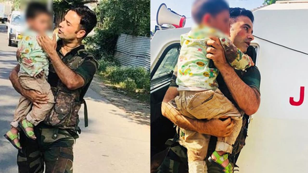 J&K Police jump to the rescue of 3 yr old during terror attack J&K Police jump to the rescue of 3 yr old during terror attack