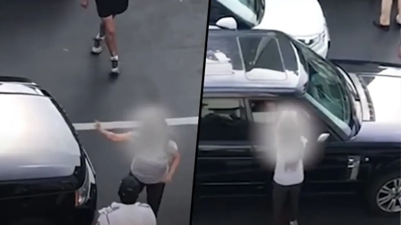 Viral video: Woman chases car, thrashes husband on Mumbai road; leads to traffic jam Viral video: Woman chases car, thrashes husband on Mumbai road; leads to traffic jam