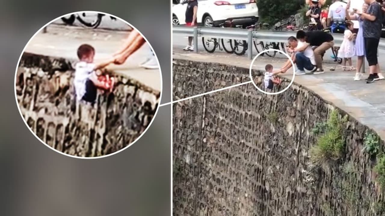 കുഞ്ഞിനെ കൊക്കയിലേക്ക് തൂക്കിയിട്ട് ചൈനക്കാരന്റെ ഫോട്ടോഗ്രാഫി ഭ്രാന്ത്, കടുത്ത വിമർശനവുമായി സോഷ്യൽ മീഡിയ