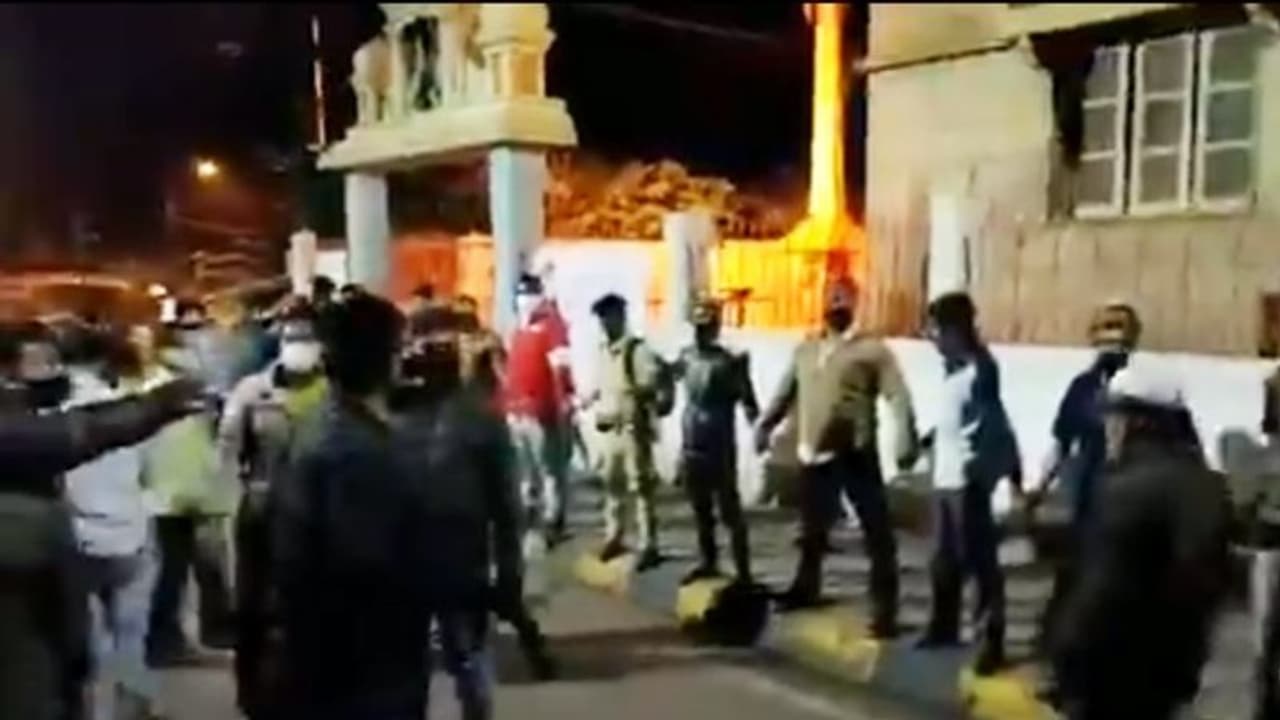 Bengaluru violence: Muslim men form human chain to protect temple; video goes viral Bengaluru violence: Muslim men form human chain to protect temple; video goes viral