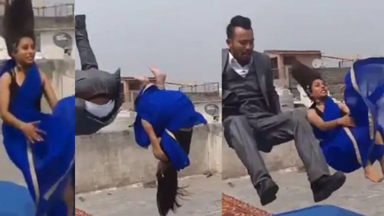 സാരിയുടുത്ത് തലകുത്തി മറിയുന്ന യുവതി; വീഡിയോ വൈറല്‍