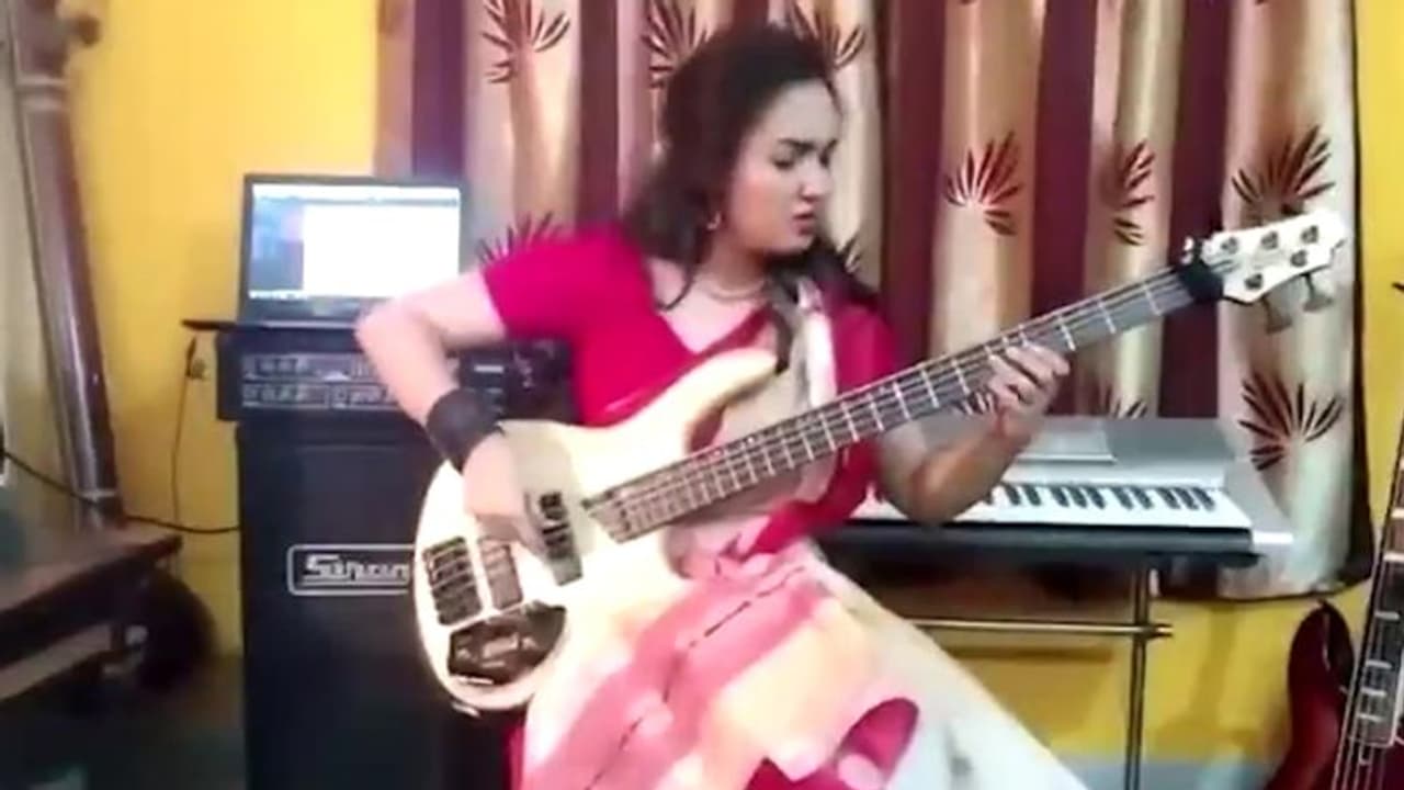 Sari clad woman plays bass riff on progressive metal song Sea of Lies; video goes viral Sari clad woman plays bass riff on progressive metal song Sea of Lies; video goes viral